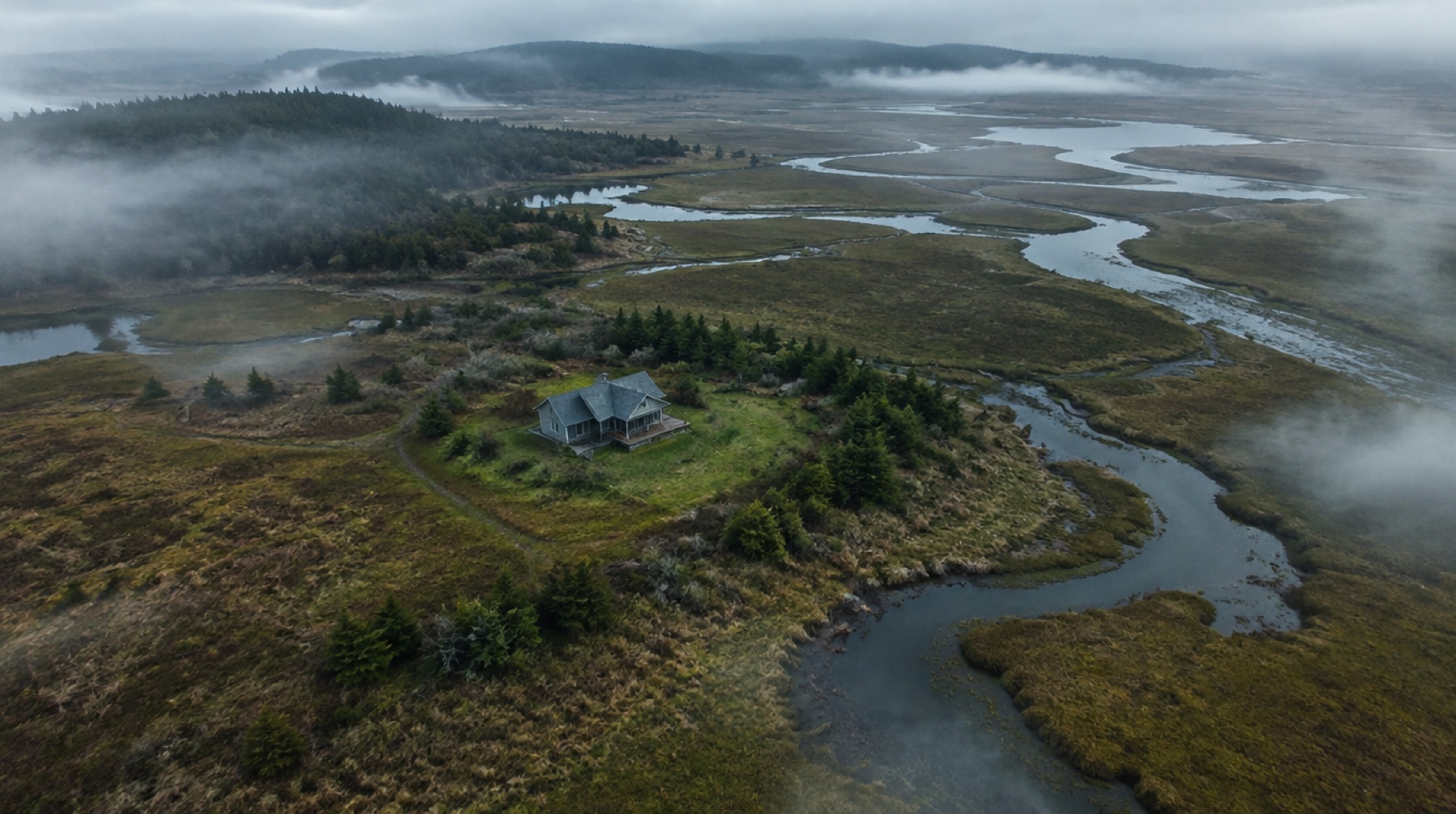 Remote house surrounded by marshland and winding creeks